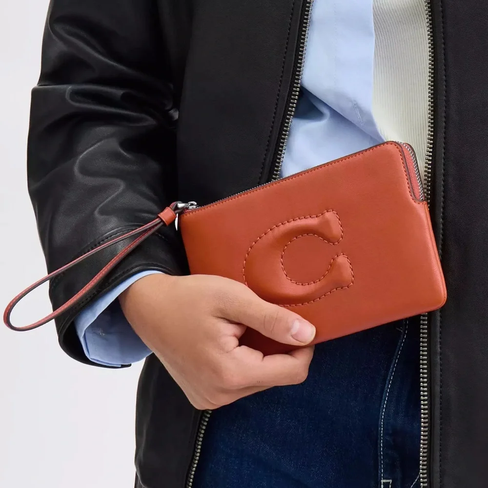 COACH Debossed Sculpted C Smooth Leather Large Corner Zip Wristlet inDark Orange